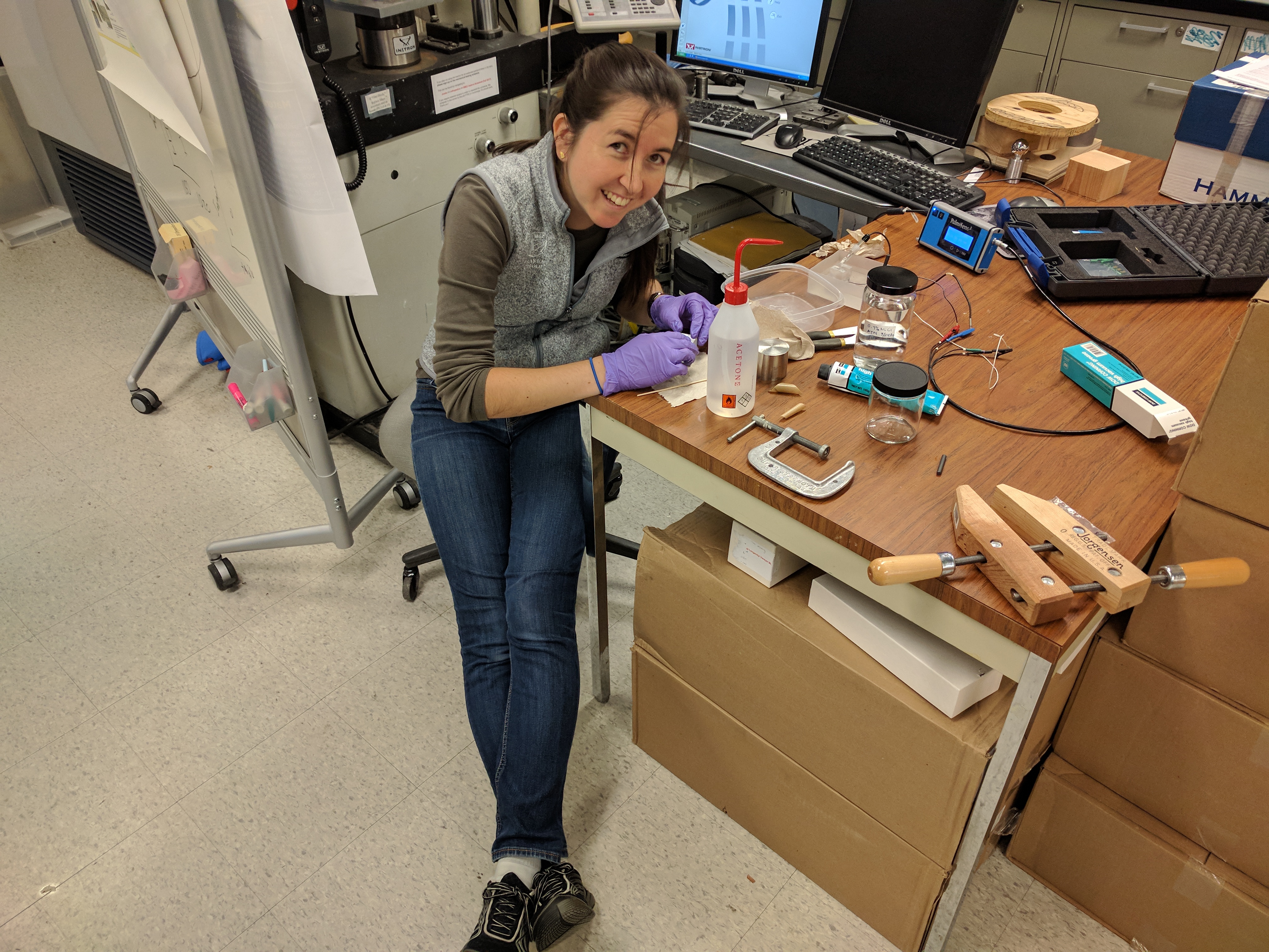  Audrey showing a young visitor our lab's shoulder simulator which simulates the movement of a shoulder and could also be used to test shoulder replacements. 