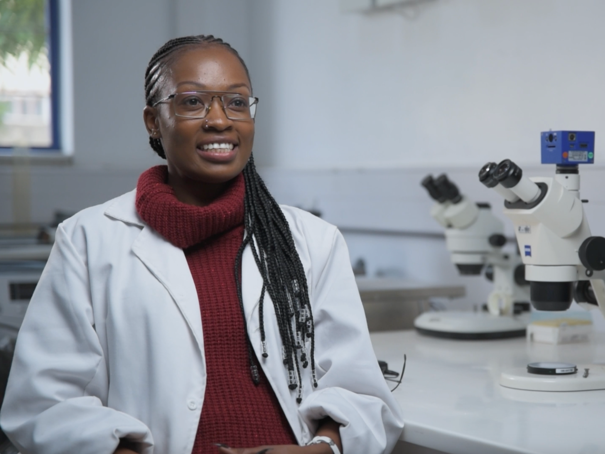 Quintar Genga sits in a lab