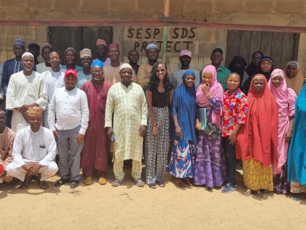 Individuals from Tegemeo and 2SCALE smile for a group picture