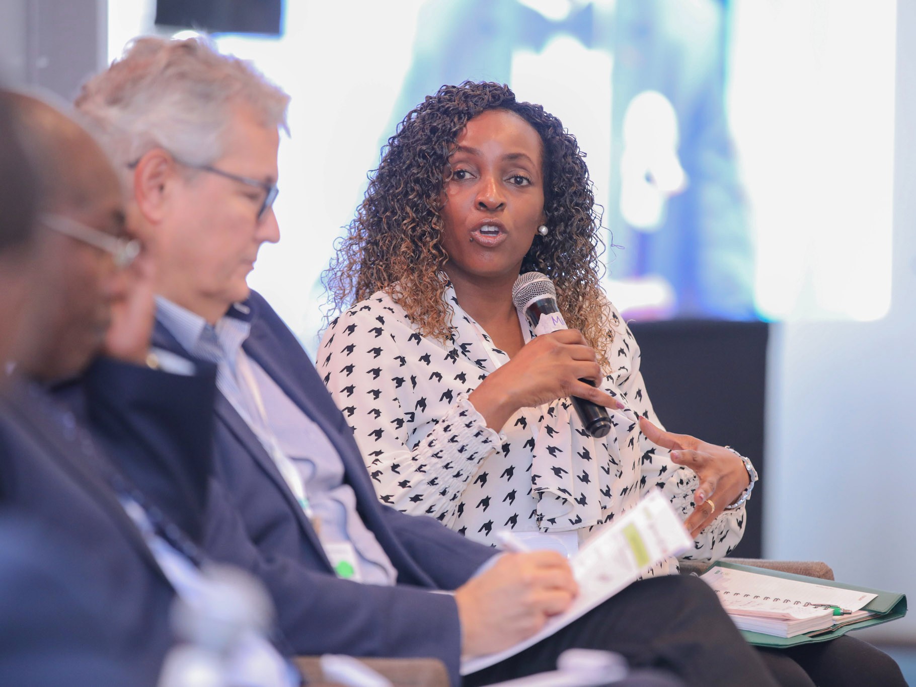 Speakers hold a discussion at an event in Kenya