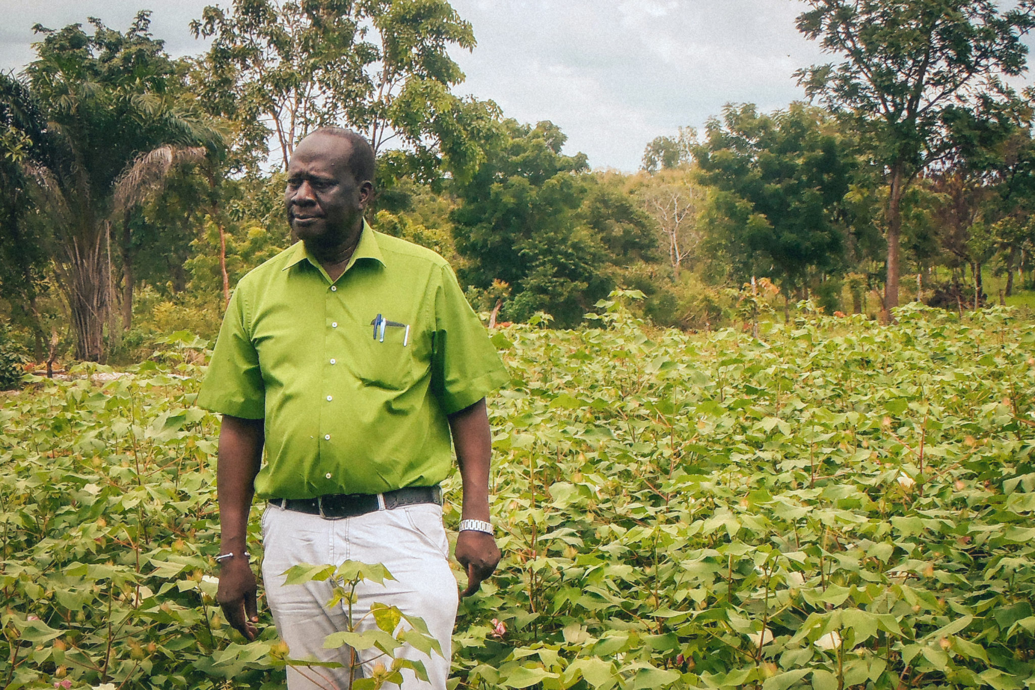Andre Bationo stands in a field